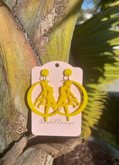 a pair of yellow earrings