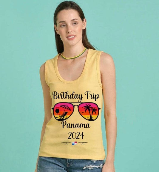 a woman wearing a yellow birthday trip tank top