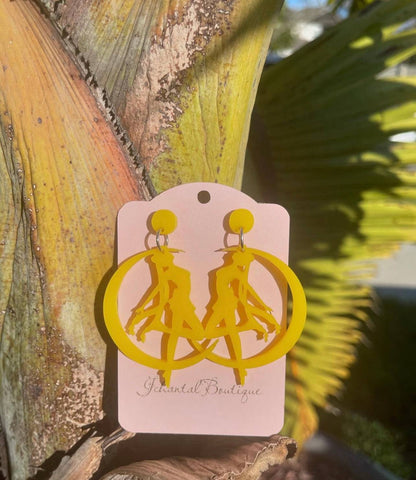 a pair of yellow earrings