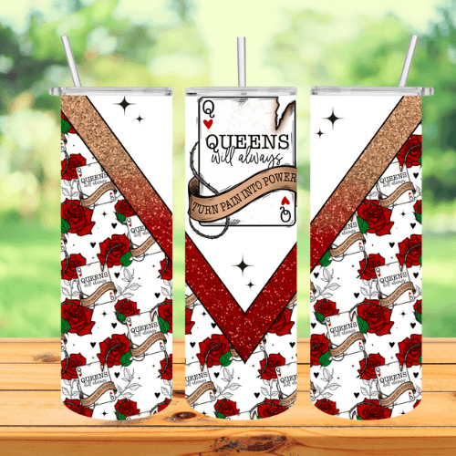 a tumbler with a queen of hearts card and a couple of red roses on a table