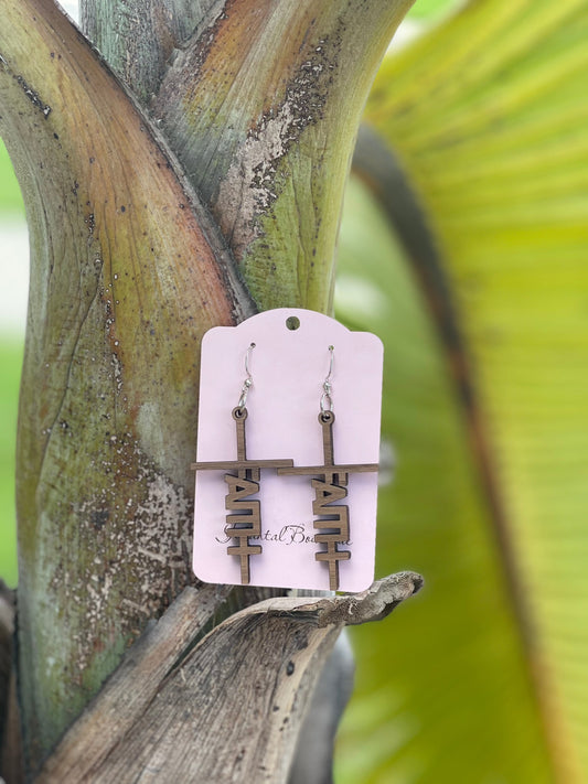 a pair of faith earrings hanging