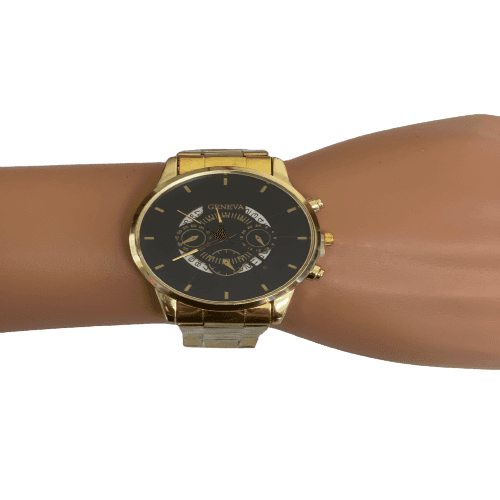 a gold wrist watch with a black face