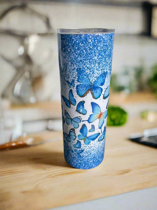 Blue Butterfly Tumbler Custom Design from Jchantal Boutique featuring vivid blue butterflies and glitter accents on stainless steel drinkware.
