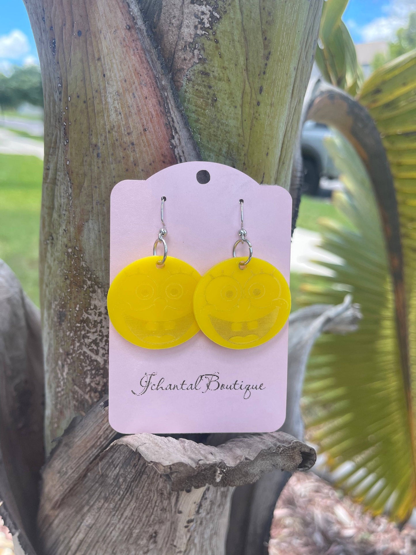 a pair of Spongebob yellow earrings