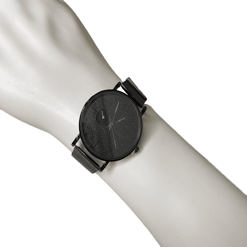 a wrist watch on a white mannequin hand