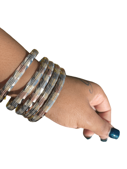 a woman's arm with a stack of bracelets on it