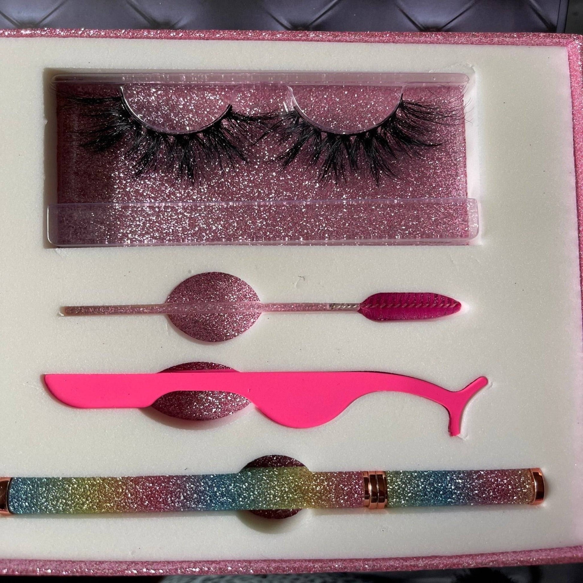 a pink box with a pair of false eyelashes and a pair of pink eyeliner